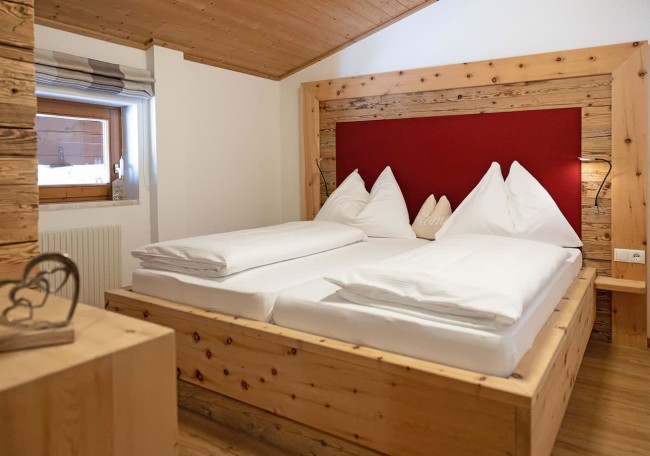 A cozy wooden bedroom