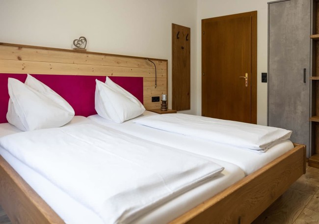 A neatly made double bed